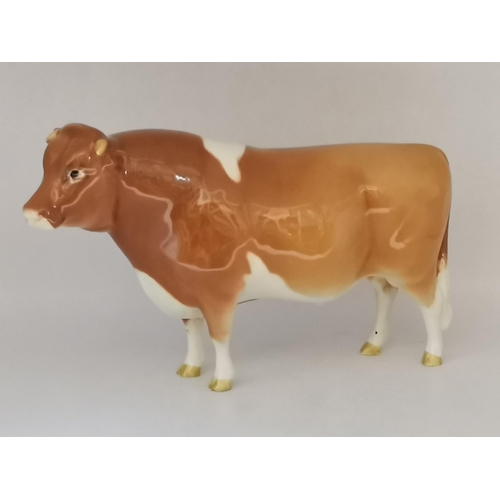 88 - A collection of Beswick animal figures, comprising Angus cow and bull, black gloss, gold backstamp a... 