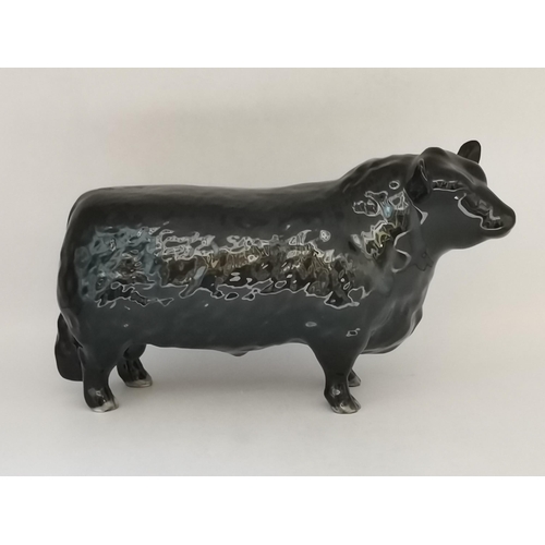 88 - A collection of Beswick animal figures, comprising Angus cow and bull, black gloss, gold backstamp a... 