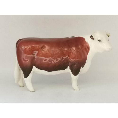 88 - A collection of Beswick animal figures, comprising Angus cow and bull, black gloss, gold backstamp a... 