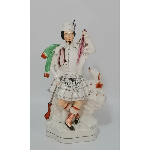 117 - Three Antique Staffordshire figurines - Flatback Highlander Couple with Clock H35cm, Large flatbacke... 