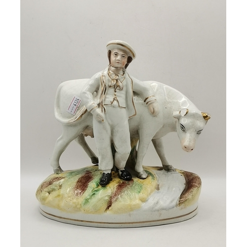 117 - Three Antique Staffordshire figurines - Flatback Highlander Couple with Clock H35cm, Large flatbacke... 