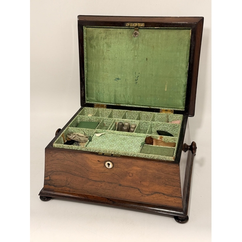 5 - A 19th Century tabletop work box, sarcophagus form with hinged cover and turned knob handles, the li... 