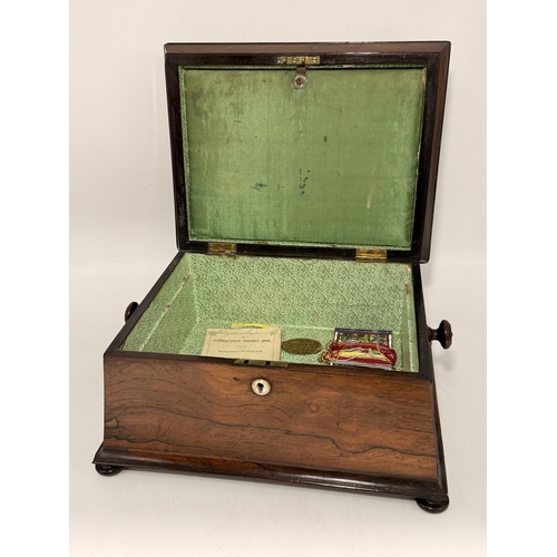 5 - A 19th Century tabletop work box, sarcophagus form with hinged cover and turned knob handles, the li... 