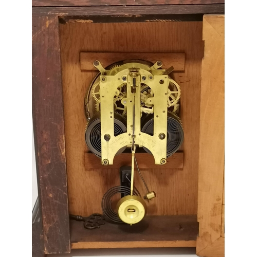 54 - An American style mahogany mantel clock with markings ANSONIA CLOCK COMPANY