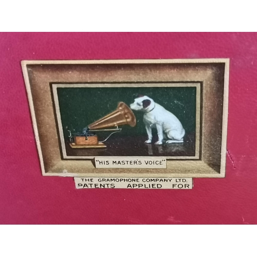 68 - A vintage HMV portable gramophone, in red leather case with gilt-metal fittings, corner spin-tray wi... 