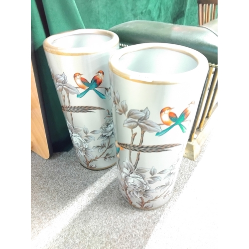 576 - A pair of umbrella stands with gilt and siulver decoration and floers and bird decoration 48cm