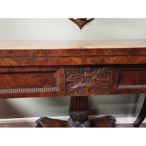 634 - A very good quality William IV burr yew wood games table with lion paw feet and highly decorative ce... 