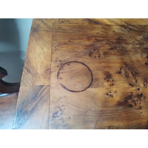 634 - A very good quality William IV burr yew wood games table with lion paw feet and highly decorative ce... 