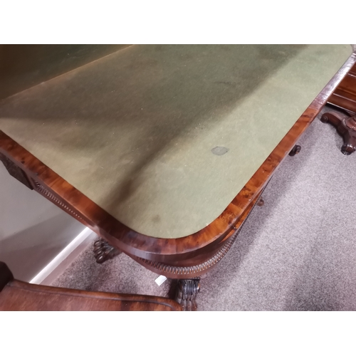 634 - A very good quality William IV burr yew wood games table with lion paw feet and highly decorative ce... 