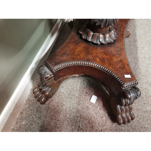 634 - A very good quality William IV burr yew wood games table with lion paw feet and highly decorative ce... 