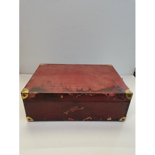 68 - A vintage HMV portable gramophone, in red leather case with gilt-metal fittings, corner spin-tray wi... 