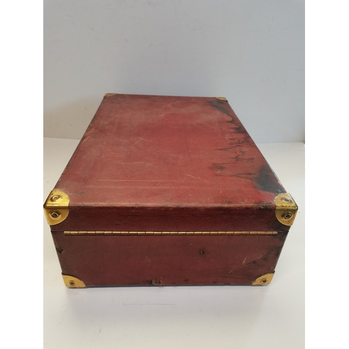 68 - A vintage HMV portable gramophone, in red leather case with gilt-metal fittings, corner spin-tray wi... 