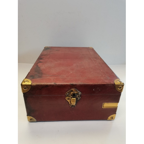 68 - A vintage HMV portable gramophone, in red leather case with gilt-metal fittings, corner spin-tray wi... 