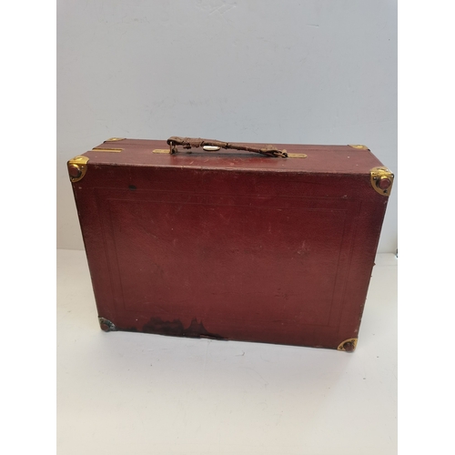 68 - A vintage HMV portable gramophone, in red leather case with gilt-metal fittings, corner spin-tray wi... 