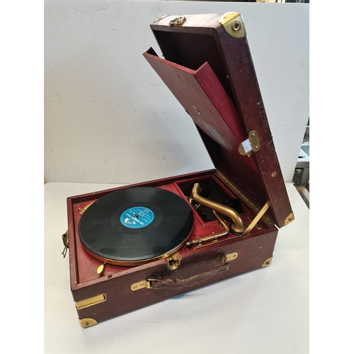 68 - A vintage HMV portable gramophone, in red leather case with gilt-metal fittings, corner spin-tray wi... 