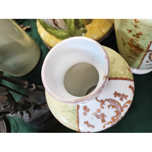 22 - An opaline glass garniture, comprising a large vase and cover together with two smaller vases, each ... 