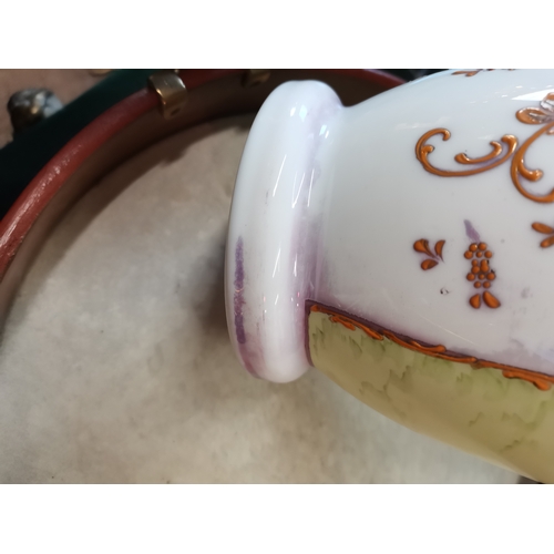 22 - An opaline glass garniture, comprising a large vase and cover together with two smaller vases, each ... 