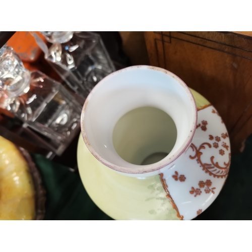 22 - An opaline glass garniture, comprising a large vase and cover together with two smaller vases, each ... 