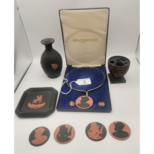 Wedgwood Egyptian Revival: A collection of black basalt and Rosso Antico Jasperware cameos, late 1970s, depicting portraits of Queen Ankhesenamun and Tutankhamun, including a pendant necklace in original box; together with a vase, square trinket dish and ink well variously decorated with winged Sphinx, Horus and flowerheads. (10)

The cameos were produced to commemorate the Tutankhamun exhibition at the British Museum.