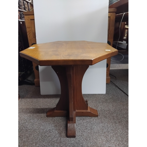 873 - An octagonal oak Squirrel man side table 45cm diameter
