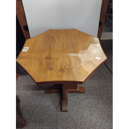 873 - An octagonal oak Squirrel man side table 45cm diameter