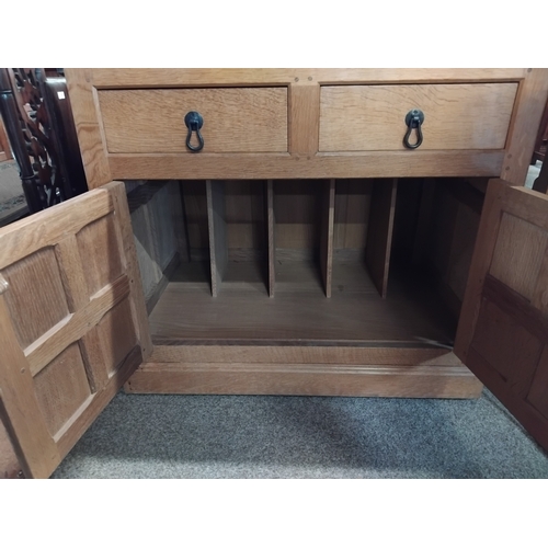 874 - A Yorkshire oak cupboard with 2 drawers and cupboards below 75cm x 45cm x 70cm ( Mouseman interest )