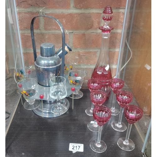 217 - Vintage cocktail shaker, sticks, glasses and holder plus Bohemian cut crystal decanter and 6 glasses