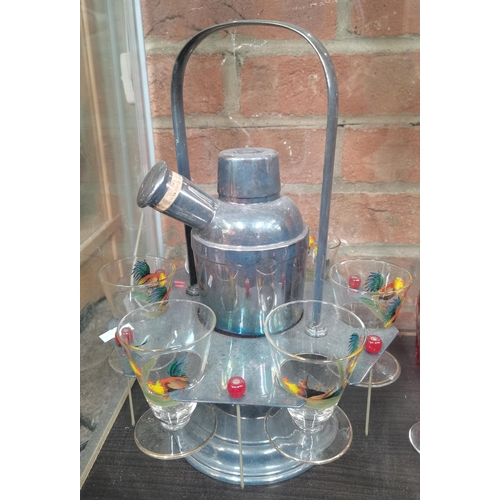 217 - Vintage cocktail shaker, sticks, glasses and holder plus Bohemian cut crystal decanter and 6 glasses
