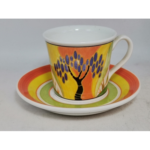 228 - Three Clarice Cliff items - coffee cup and saucer Windbells' patter, Sugar Sifter and Cup