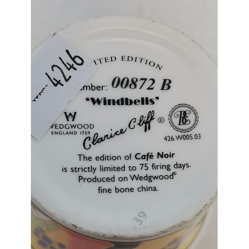 228 - Three Clarice Cliff items - coffee cup and saucer Windbells' patter, Sugar Sifter and Cup