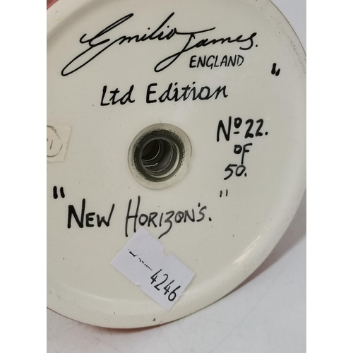 228 - Three Clarice Cliff items - coffee cup and saucer Windbells' patter, Sugar Sifter and Cup