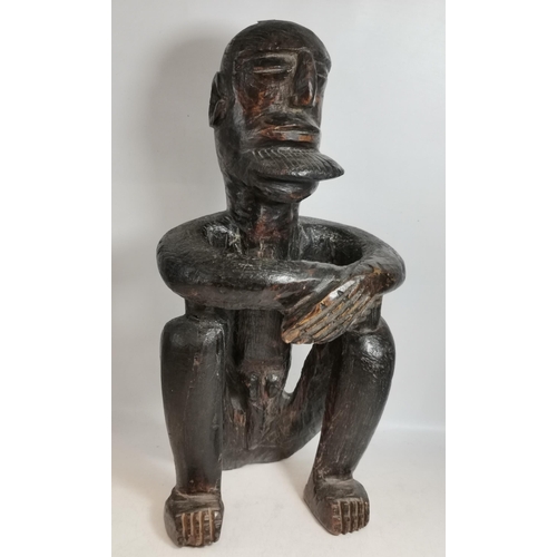 232 - A Seated African Carved Figure plus 18/19c African Slave Bangle/Anklet