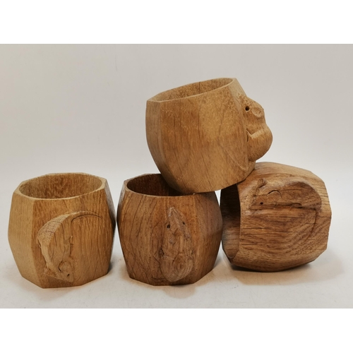 249 - A set of Four Robert Thompson, Mouseman oak Napkin Rings H5cm with signature mouse carved to outside... 