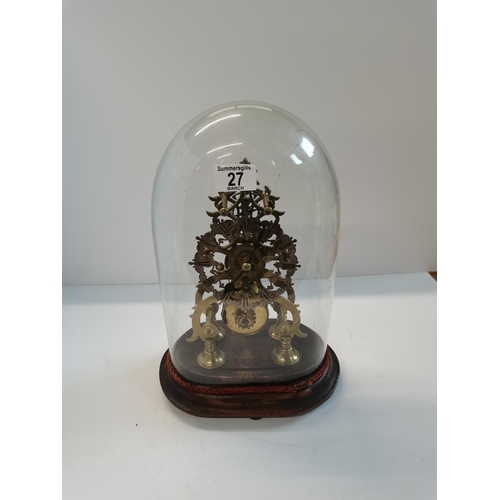 27 - Antique brass skeleton clock encased in glass dome on wooden base 36cm height