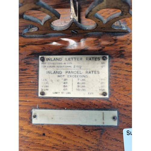 34 - Antique balance scale with wooden base and brass components and set of nesting weights