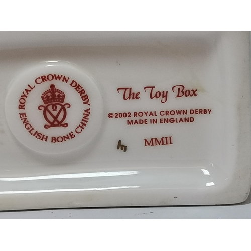 265 - Three Royal Crown Derby Paperweights - The Toy Box with ceramic button, Snake with Silver stopper, D... 