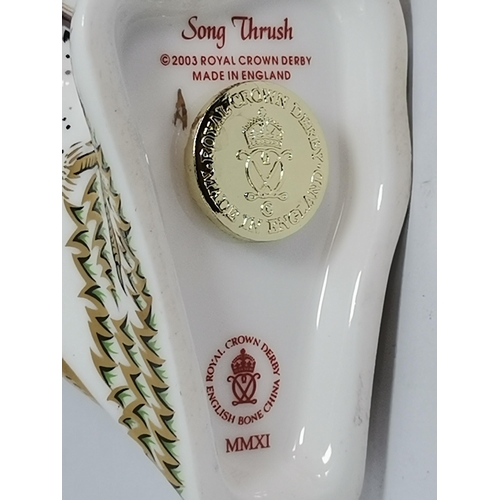 289 - Crown Derby Violet Budgerigar and Crown Derby Song Thrush paperweights both with gold stoppers