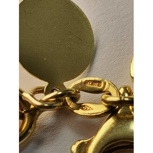 578 - An Italian 18 carat gold fancy-link bracelet hung with an assortment of charms, mostly 18ct, some 14... 