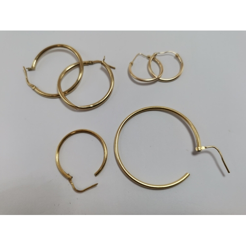 591 - Two pairs of 9 carat gold hoop earrings, stamped '375', and two 18 carat gold hoops of differing siz... 