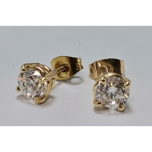A pair of yellow gold diamond stud earrings, with threaded posts, unmarked. 6mm diameter, 1.6g gross

Total diamond weight 1.5ct, colour I/J, clarity VS