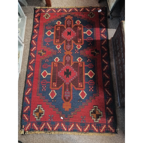 807 - 2 x Antique wool small rugs 1.4m x 90cm both in red, blues and cream