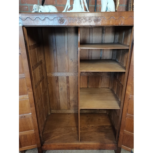 809 - A  very rare early mouseman  oak panelled double wardrobe, beautifully patinated with each wardrobe ... 