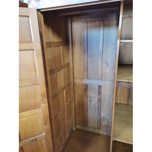 808 - A  very rare early mouseman  oak panelled double wardrobe, beautifully patinated with each wardrobe ... 
