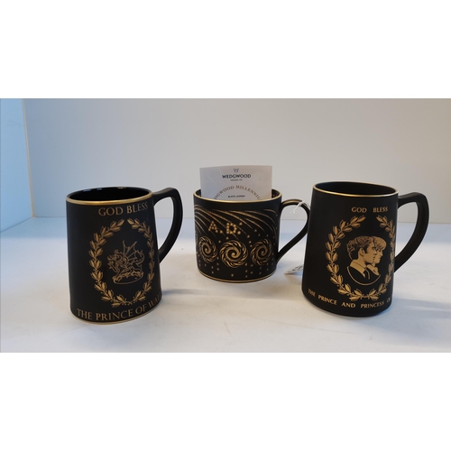 102 - Three Wedgwood black Jasperware commemorative mugs, with gilded decoration, comprising New Millenniu... 