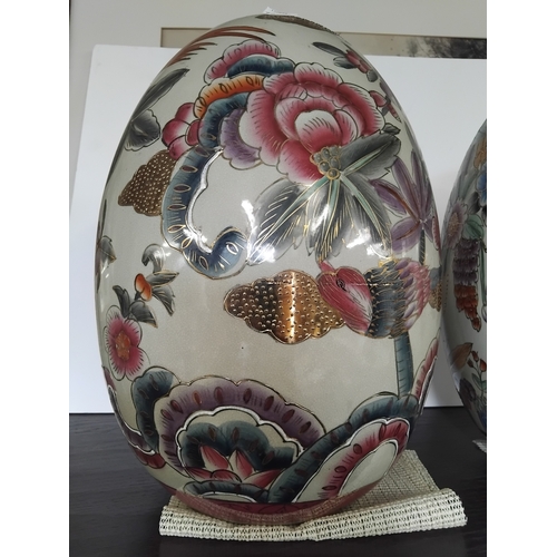 6 - A pair vintage large porcelain egg figurines 'Satsuma style' with highly decorated floral and bird f... 