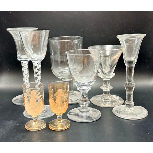  A collection of eight vintage glasses including
Georgian twisted opaque stem wine glasses etc