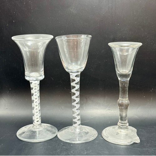  A collection of eight vintage glasses including
Georgian twisted opaque stem wine glasses etc