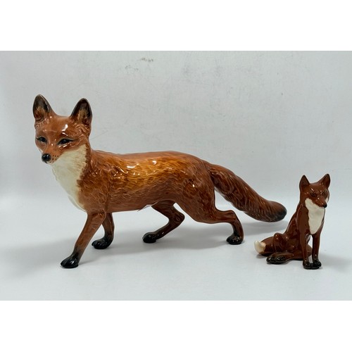 107 - Two Beswick Fox figurines