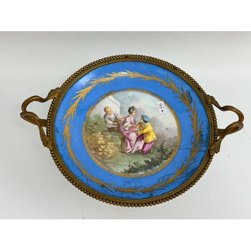 115 - Gilt Bronze-Mounted serves Bleu celeste porcelain tazza D25, candlestick holder plus a paid of Peaco... 