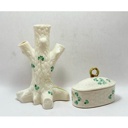 123 - Two Pieces of Shamrock Belleek, a tree trunk vase and a lidded trinket box